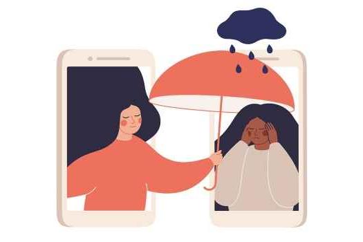 朋友撑伞遮住悲伤的朋友，两人都在用手机