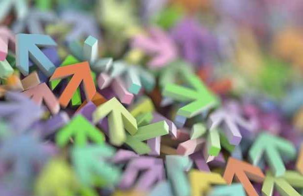 Colorful three-dimensional arrows in a pile